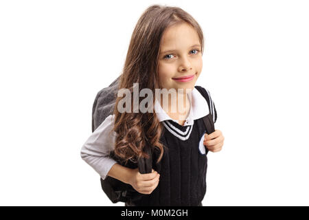 Petite lycéenne regardant la caméra et smiling isolé sur fond blanc Banque D'Images