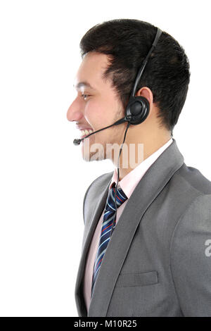 Opérateur souriant fait son travail avec casque isolé sur fond blanc Banque D'Images