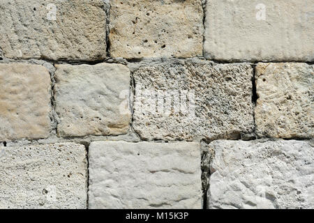 Vieux Mur de blocs de pierre fait surface Banque D'Images