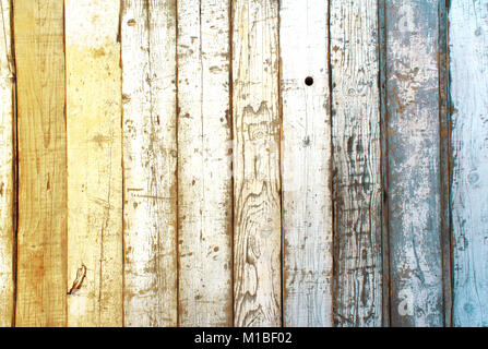 Texture de bois ancien avec de la peinture craquelée blanc, jaune et bleu Banque D'Images