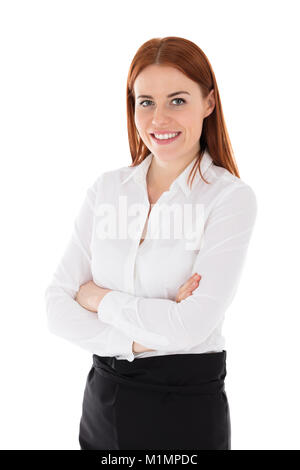 Portrait Of Happy Young Hostess in front of White Background Banque D'Images