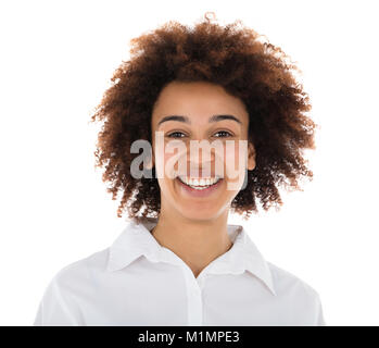 Portrait Of A Smiling Hostess standing in front of White Background Banque D'Images