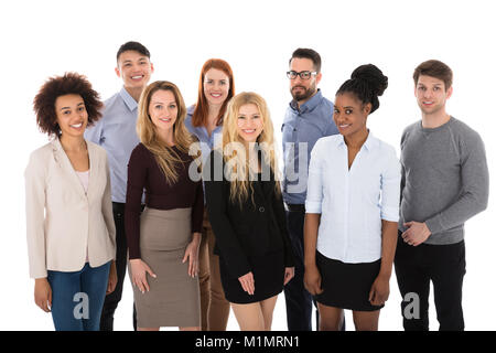 Portrait Of Happy College Students Standing contre fonds blancs Banque D'Images