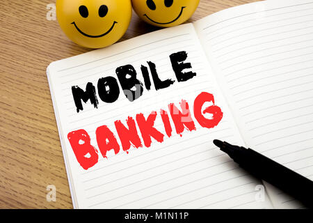 Légende manuscrite montrant Mobile Banking. L'écriture du concept d'entreprise pour les services bancaires par Internet e-banque rédiger portable avec copie espace sur book backgrou Banque D'Images