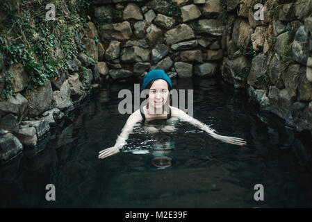 Portrait of smiling Caucasian woman wearing stocking-cap natation Banque D'Images