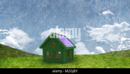 Panneau solaire Eco house en champ vert Banque D'Images