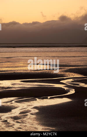 Coucher du soleil à marée basse sur Golden Bay. Puponga, Nelson Tasmanie, Nouvelle-Zélande. Banque D'Images