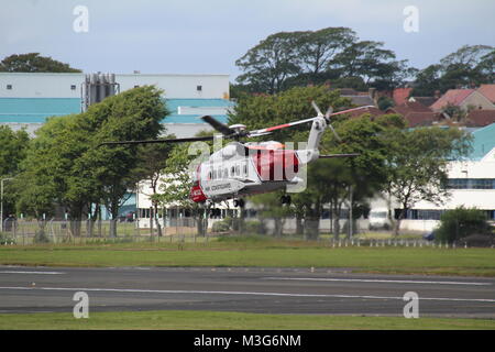 G-MCGG, un hélicoptère Sikorsky S-92A exploité par Bristow Helicopters au nom de HM Coastguard, départ de l'aéroport de Prestwick en Ayrshire. Banque D'Images