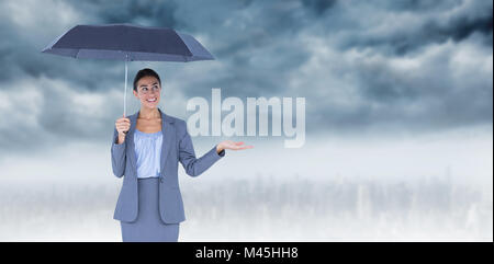 Portrait of businesswoman holding umbrella Banque D'Images