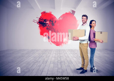 Portrait of woman holding boxes Banque D'Images