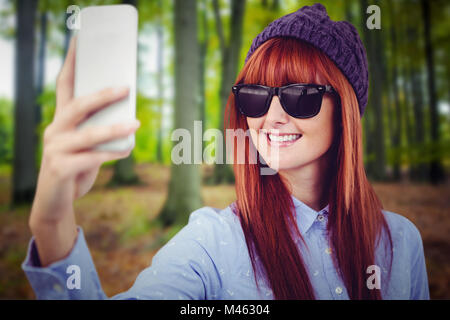 Portrait of woman taking hipster selfies Banque D'Images