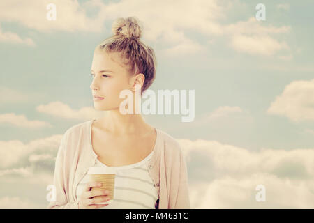 Image composite de woman holding Coffee cup Banque D'Images