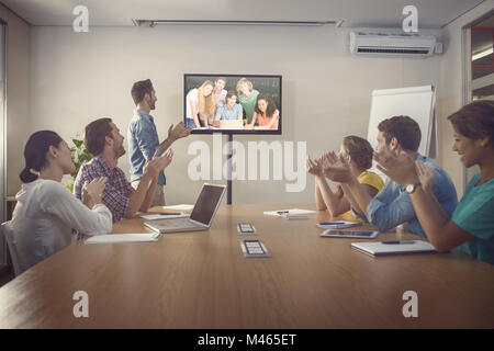 Composite image of students in computer class Banque D'Images