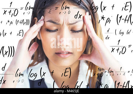 Image composite de nervous businesswoman holding sa tête Banque D'Images