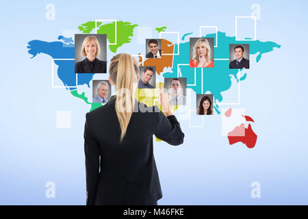 Image composite de business woman pointing Banque D'Images