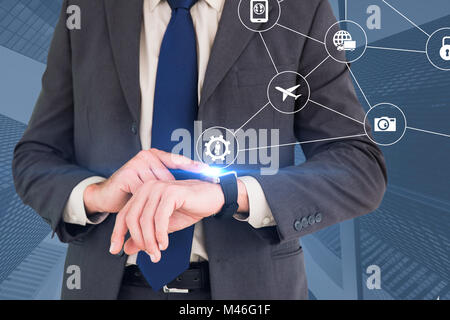 Image composite de businessman looking at watch Banque D'Images