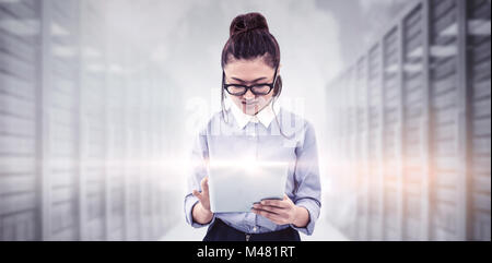 Composite image of asian businesswoman using tablet Banque D'Images