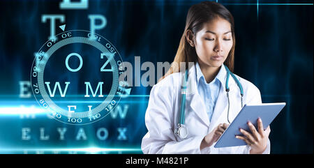 Composite image of doctor using tablet Banque D'Images