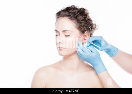 Young woman having botox injections visage. Banque D'Images