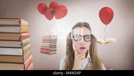 Femme portant des lunettes avec des livres sur ballons surréaliste Banque D'Images