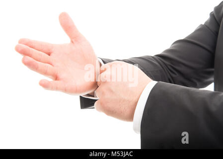 Close-up of business man mains organiser ses manches isolé sur fond blanc Banque D'Images