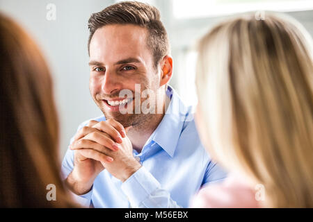 Smiling young woman with female in Banque D'Images