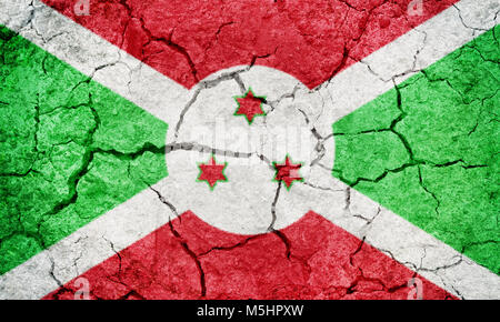 Burundi drapeau sur la terre sèche sol texture background Banque D'Images