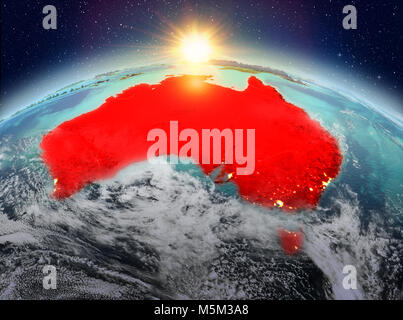 Vue de l'Australie en rouge sur la planète Terre avec des nuages au lever du soleil. 3D illustration. Éléments de cette image fournie par la NASA. Banque D'Images