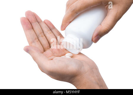 Hot woman pouring comprimés comprimés hors de bouteille en plastique blanc à la main isolé sur fond blanc. En soins de santé des personnes adultes Banque D'Images