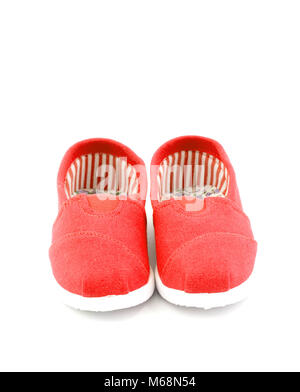 Paire de chaussures pour enfants rouge sur fond blanc Banque D'Images