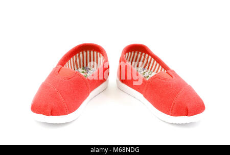 Paire de chaussures pour enfants rouge sur fond blanc Banque D'Images