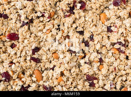 Muesli maison ou muesli aux noix et canneberges séchées comme arrière-plan. Composition horizontale Banque D'Images