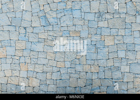 Mur de maçonnerie de pierres avec rythme irrégulier texture background Banque D'Images