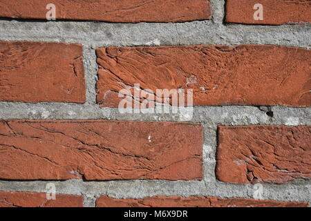 Close-up de mur de briques rouges et des joints gris Banque D'Images