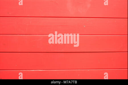 Planches en bois peint rouge vif, texture de fond, vue rapprochée avec des détails Banque D'Images