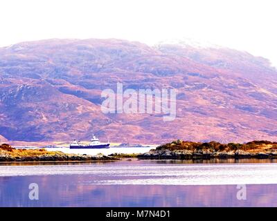 Vue de l'Isle Ornsay populaire phare. Île rocheuse au sud-est de l'île de Skye, Ecosse, Royaume-Uni. Banque D'Images