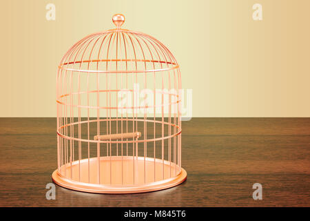 Golden cage à oiseaux sur la table en bois. Le rendu 3D Banque D'Images