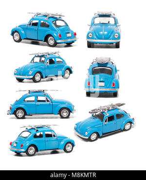 FARO, PORTUGAL : 1er février 2018 - jouet vintage Blue beetle modèle voiture voiture avec surf board isolé sur un fond blanc. Banque D'Images