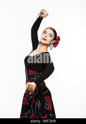 Jeune fille espagnole flamenco dancer sur un fond clair Banque D'Images