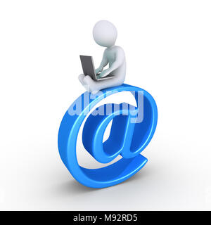 Personne à l'aide d'un ordinateur portable est assis sur le dessus d'un symbole e-mail Banque D'Images