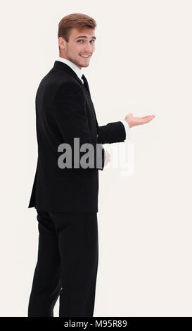 Vue arrière.smiling businessman pointing avant. photo en mode plein gr Banque D'Images