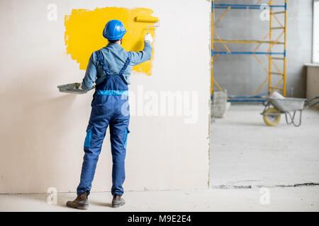 Mur à l'intérieur peinture Workamn Banque D'Images