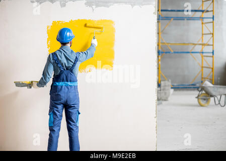 Mur à l'intérieur peinture Workamn Banque D'Images