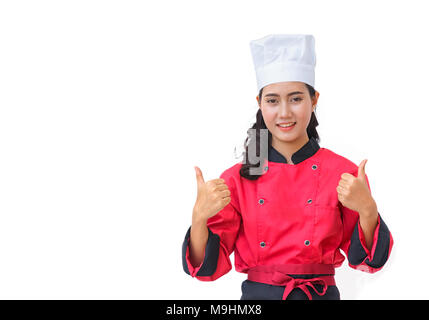 Smiling chef femme en uniforme rouge geste showing Thumbs up isolated on white Banque D'Images