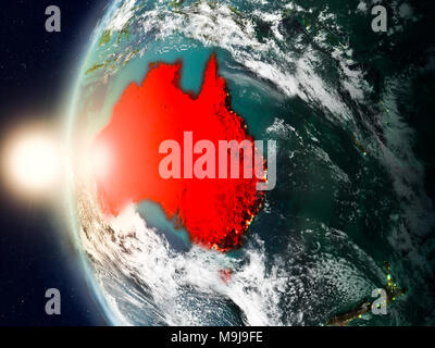 Vue de l'Australie en rouge sur la planète Terre avec des nuages et des frontières du pays visible au coucher du soleil. 3D illustration. Éléments de thi Banque D'Images