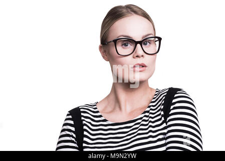 Young blonde woman in stripey haut portant des lunettes Banque D'Images