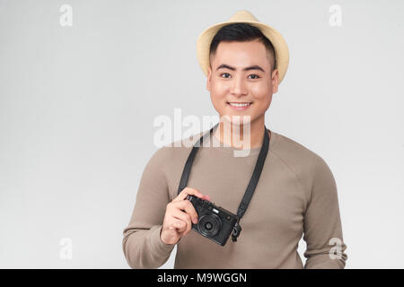 Asian young male backpacker prendre une photo Banque D'Images