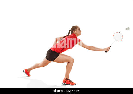 Jeune femme jouer au badminton sur fond blanc Banque D'Images