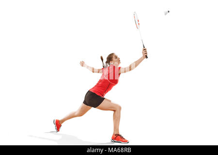 Jeune femme jouer au badminton sur fond blanc Banque D'Images