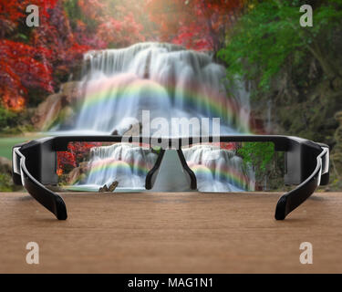 Image conceptuelle de tulipes rouges concentré dans des verres de lunettes sur la photo floue de magnifiques tulipes rouges sur le terrain matin Banque D'Images
